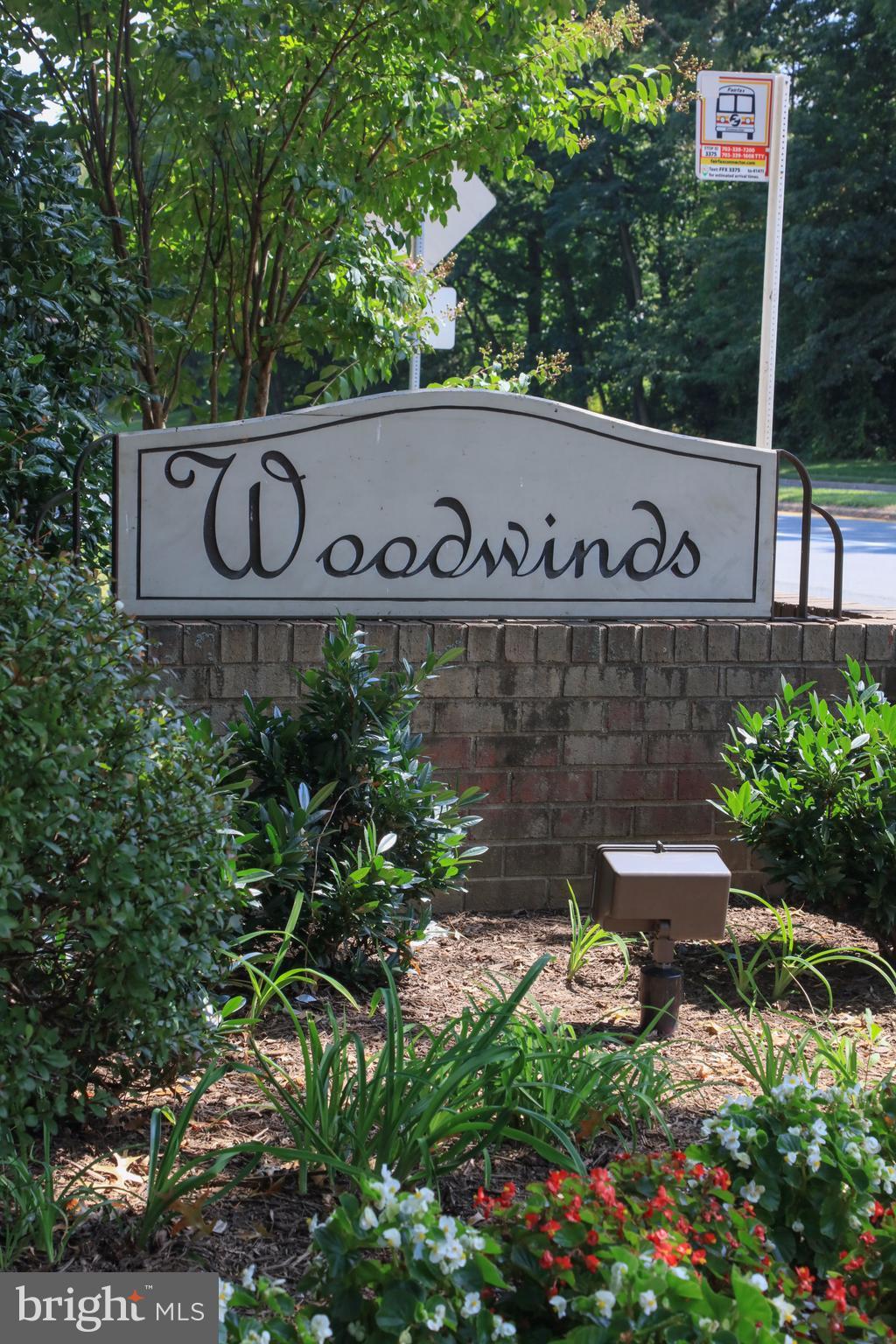 11616 Ivystone Court, Unit 301 Reston, VA 20191 - Photo 27 of 29 a sign that is sitting in front of flowers