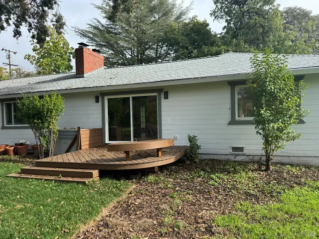 a view of outdoor space with deck and yard
