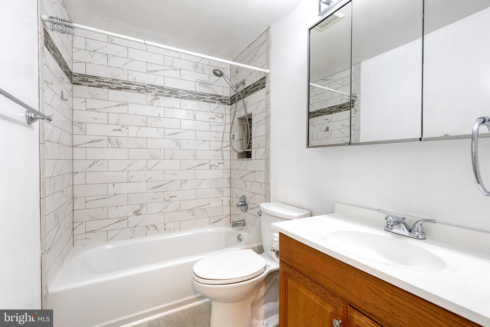 2652 April Dawn Way Gambrills, MD 21054 - Photo 17 of 26 a bathroom with a sink toilet and shower