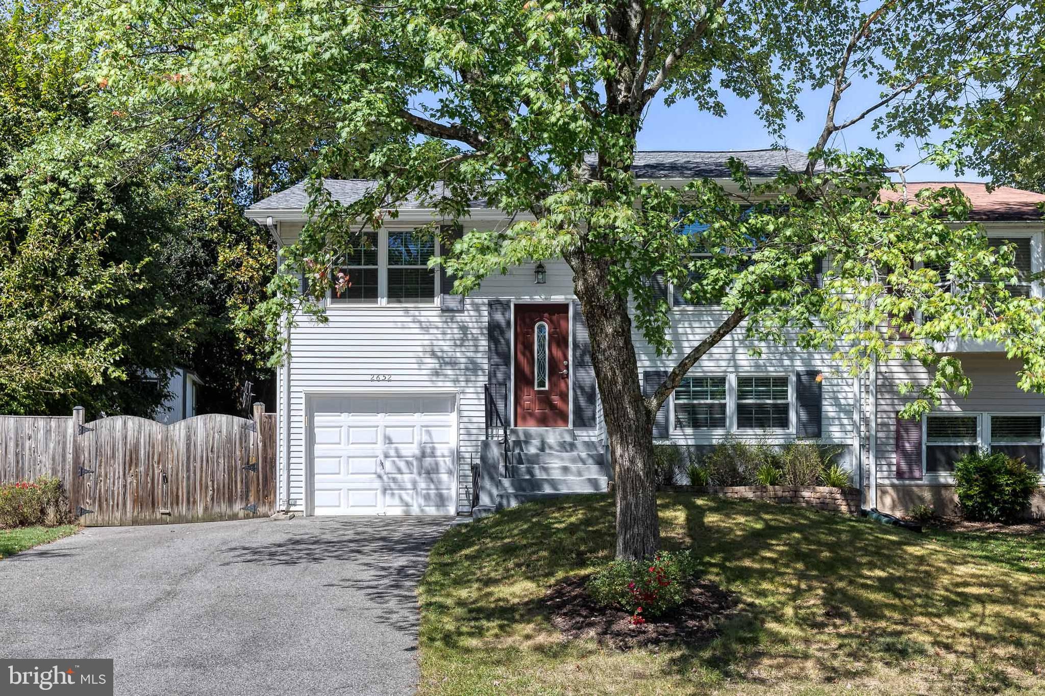 2652 April Dawn Way Gambrills, MD 21054 - Photo 2 of 26 a front view of a house with a garden