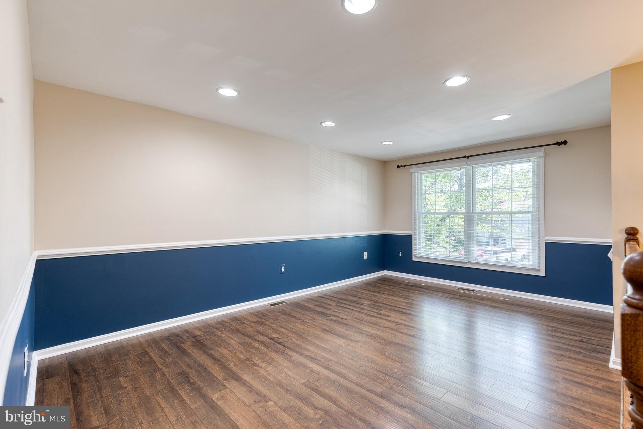 2652 April Dawn Way Gambrills, MD 21054 - Photo 3 of 26 a view of an empty room with wooden floor and a window