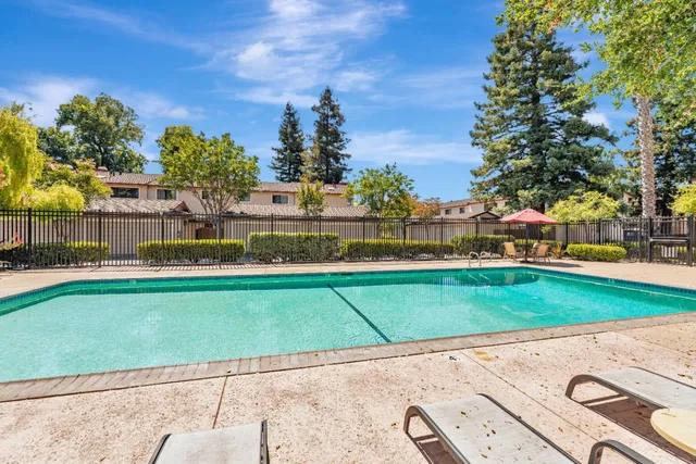 a view of a garden with a building in the background