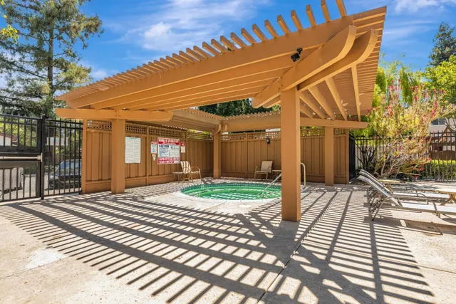 a view of a backyard with sitting area