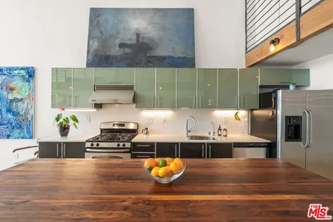 a bedroom with a bed and a chair