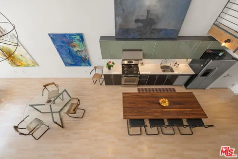 a bedroom with furniture and a wooden floor