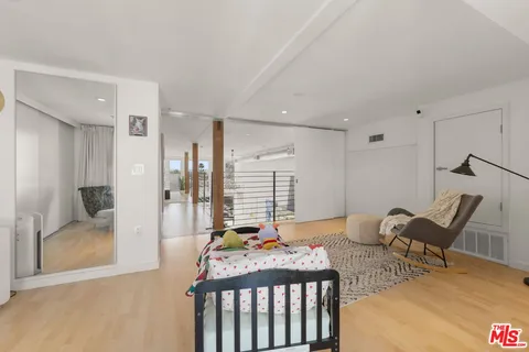 a bathroom with a sink toilet a mirror and shower