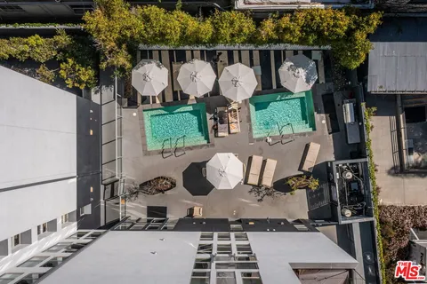 a view of a backyard with sitting area