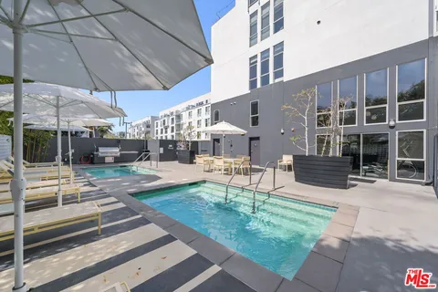 a view of a building with sitting area