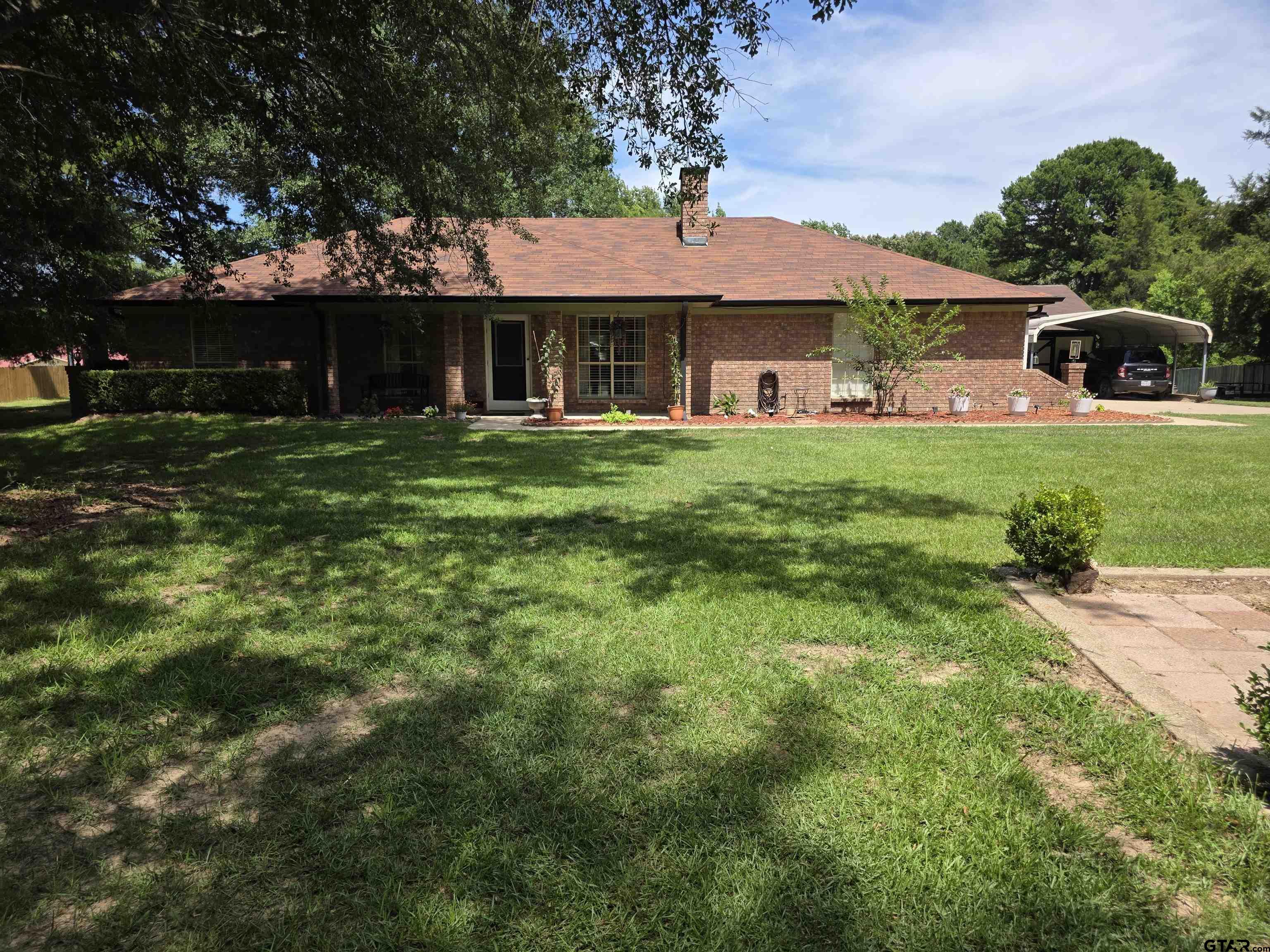 6170 Highway 271 Mount Pleasant, TX 75455 - Photo 1 of 43 a front view of a house with a yard