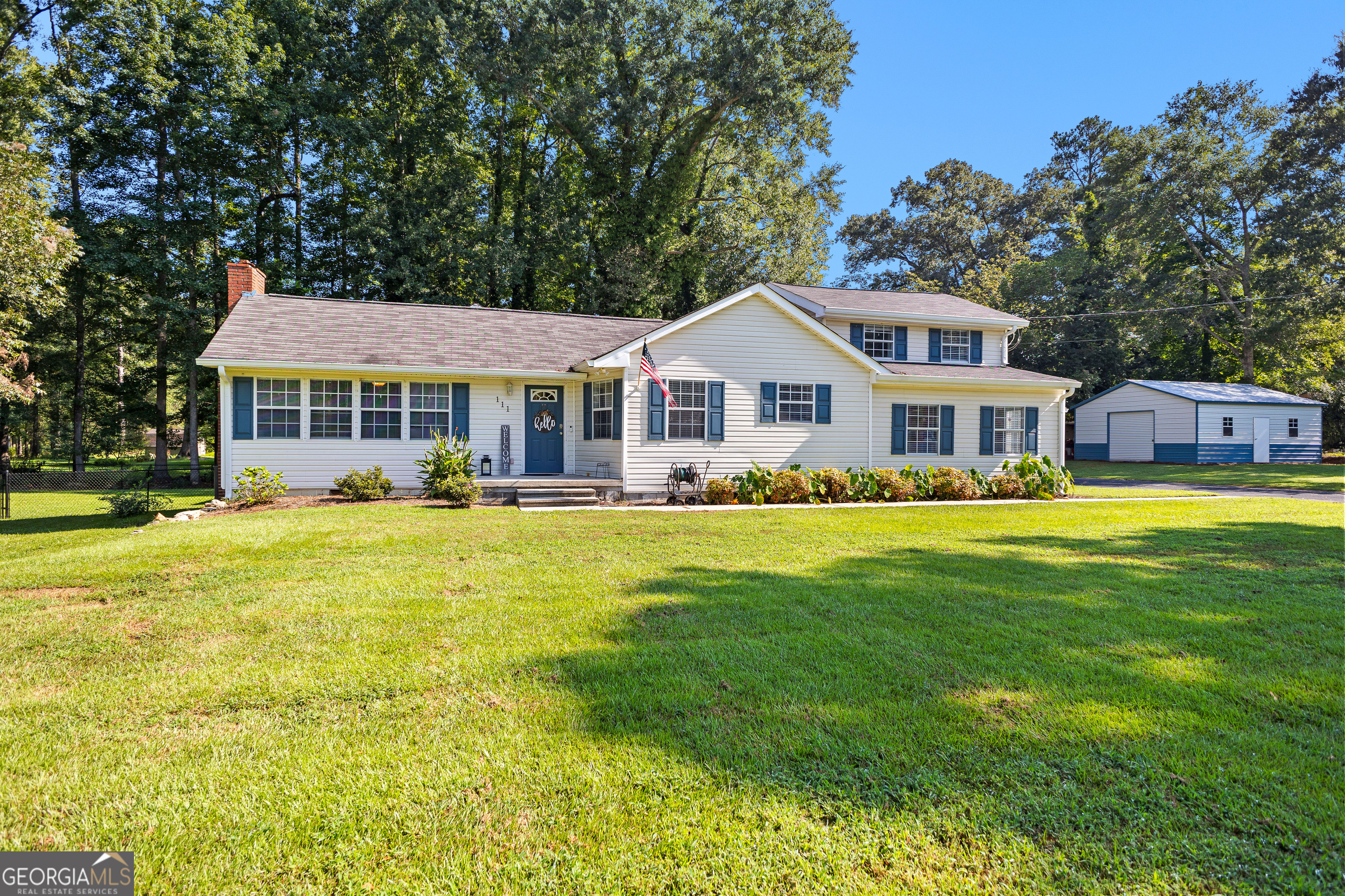 111 Zebulon Street Milner, GA 30257 - Photo 1 of 1 a front view of a residential houses with yard and green space