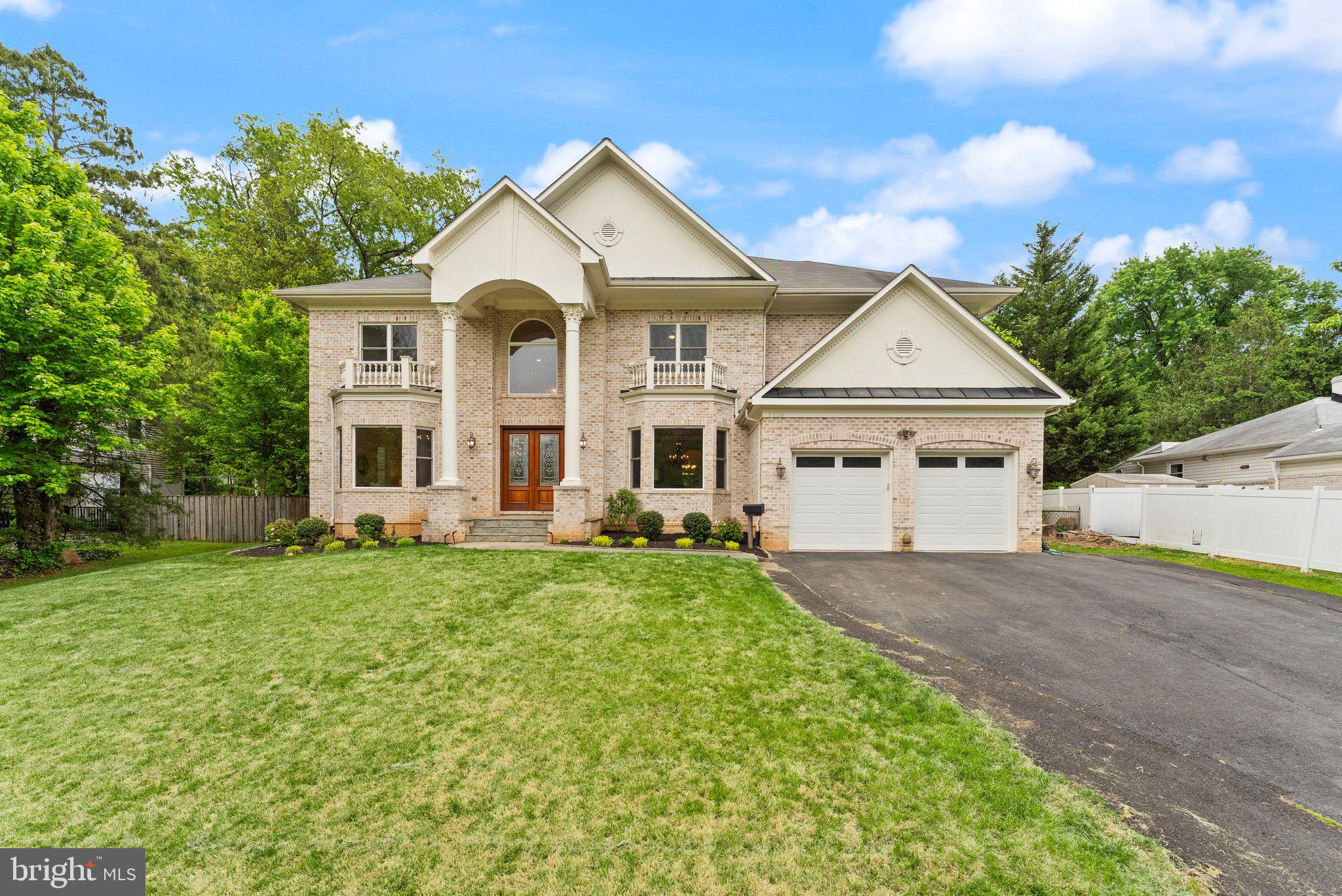 3906 Estel Road Fairfax, VA 22031 - Photo 1 of 122 a front view of a house with a yard and garage