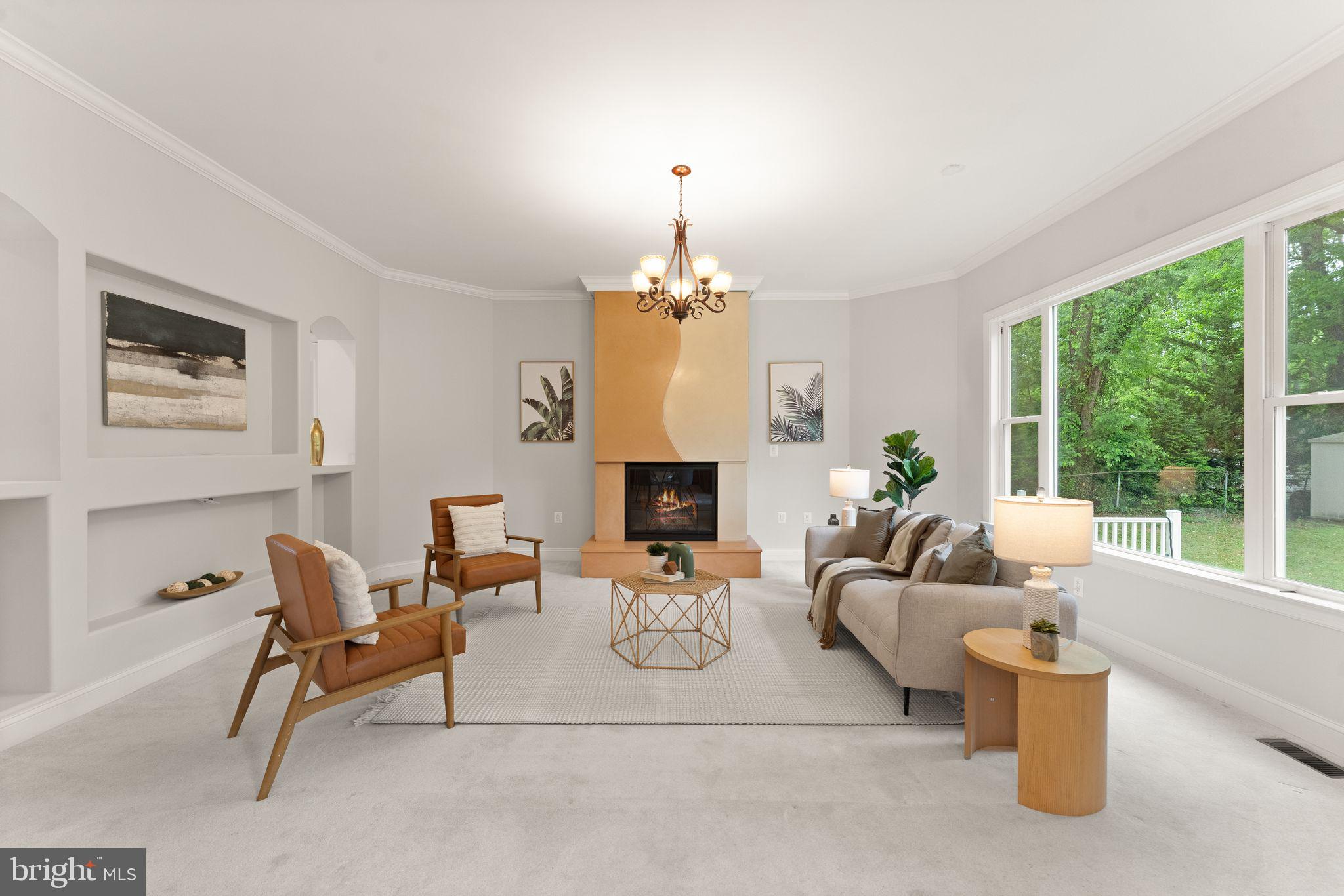3906 Estel Road Fairfax, VA 22031 - Photo 27 of 122 a living room with furniture a fireplace and a chandelier