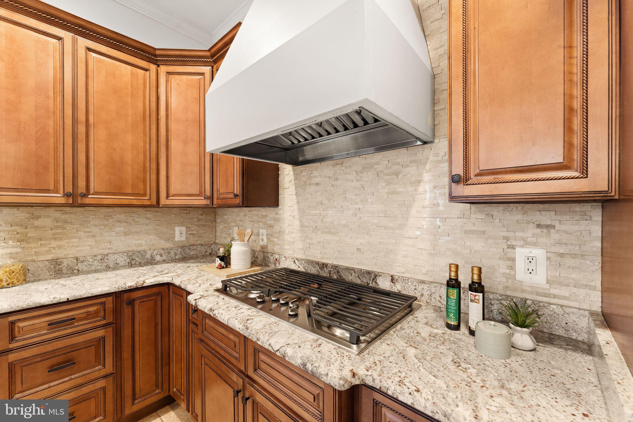3906 Estel Road Fairfax, VA 22031 - Photo 37 of 122 a kitchen with stainless steel appliances granite countertop a sink stove and cabinets