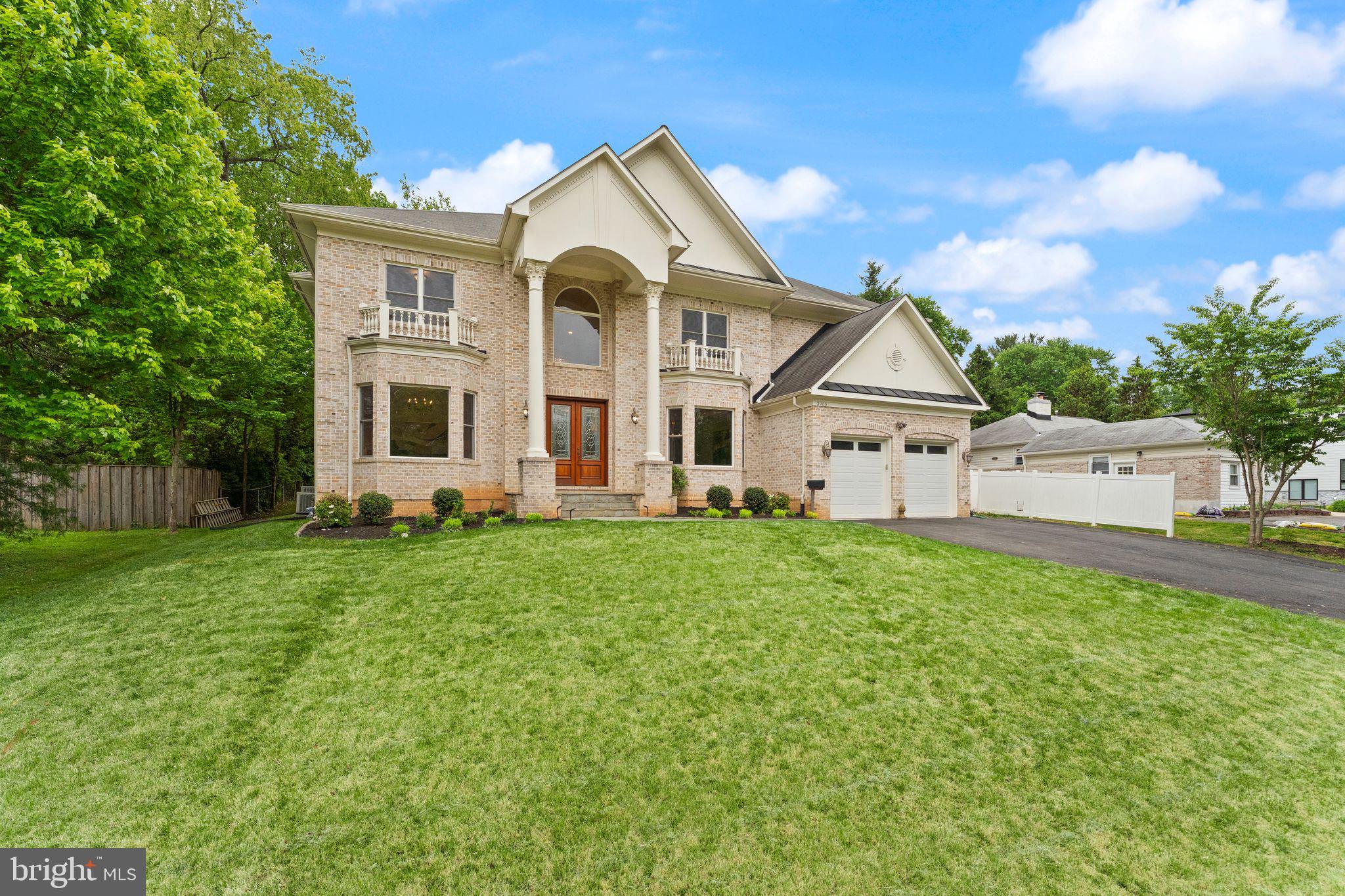 3906 Estel Road Fairfax, VA 22031 - Photo 4 of 122 a front view of a house with a yard