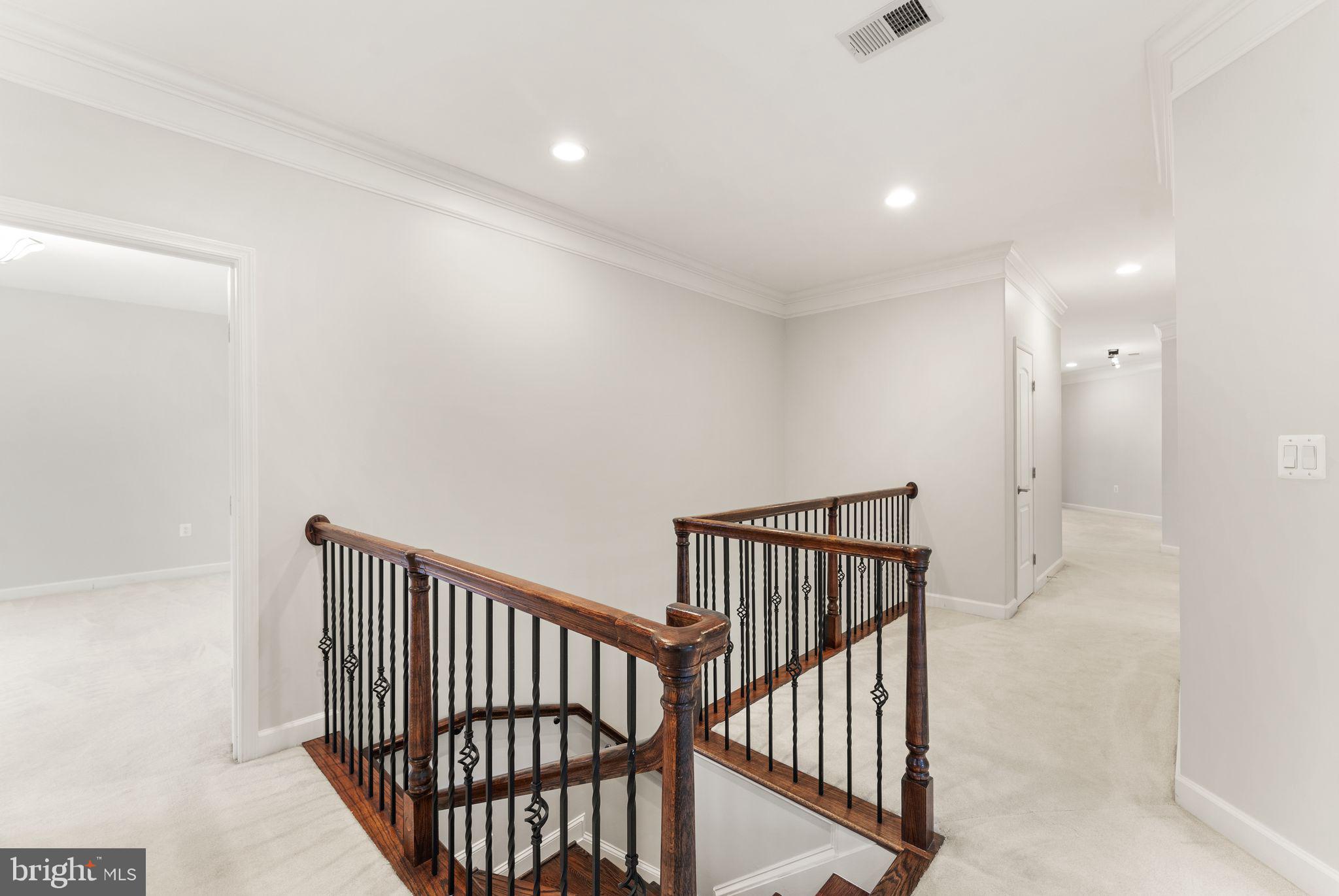 3906 Estel Road Fairfax, VA 22031 - Photo 46 of 122 a view of staircase with railing and a rug