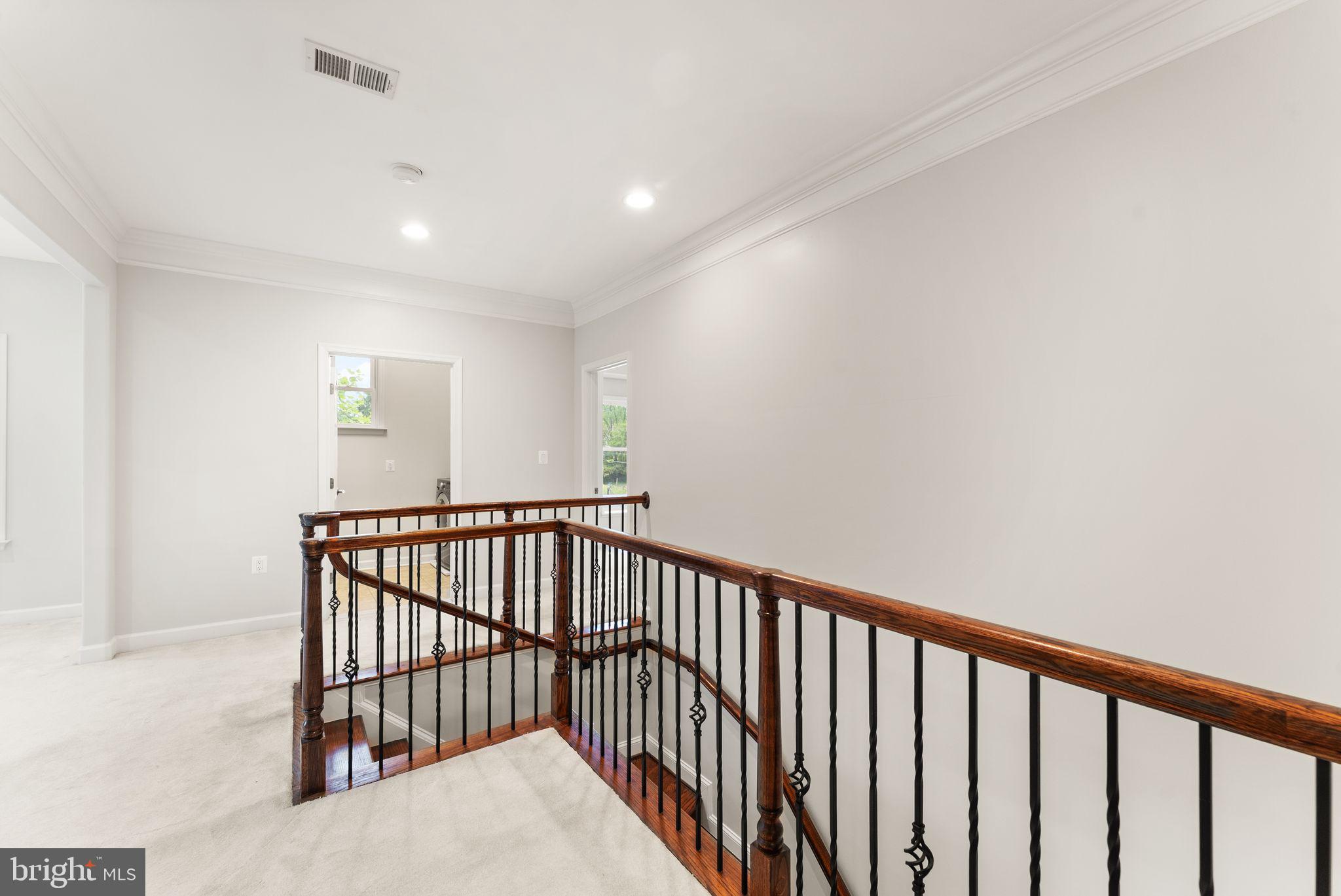 3906 Estel Road Fairfax, VA 22031 - Photo 47 of 122 a view of staircase with railing and a window
