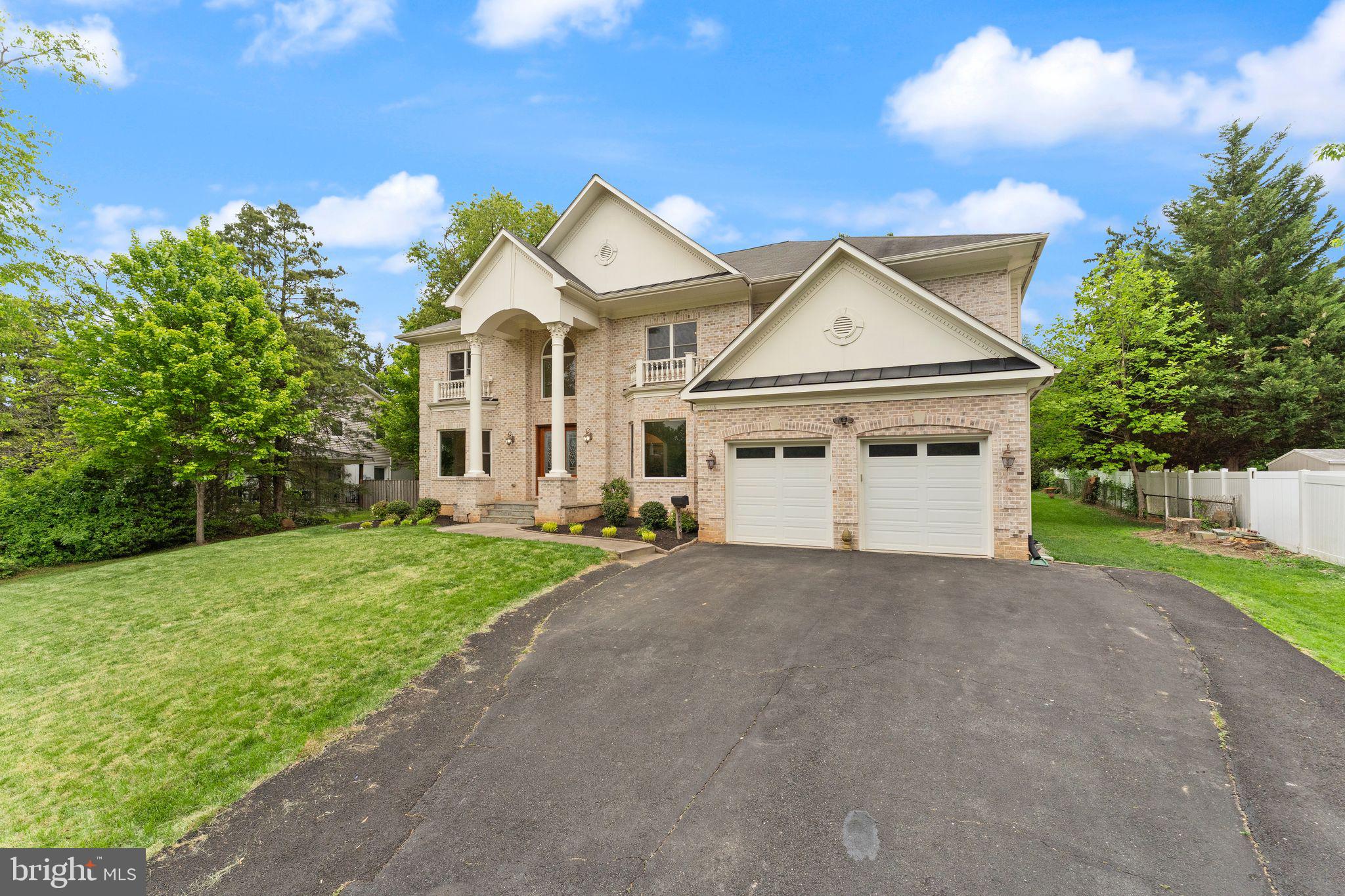 3906 Estel Road Fairfax, VA 22031 - Photo 5 of 122 a view of a white house next to a yard and a large tree