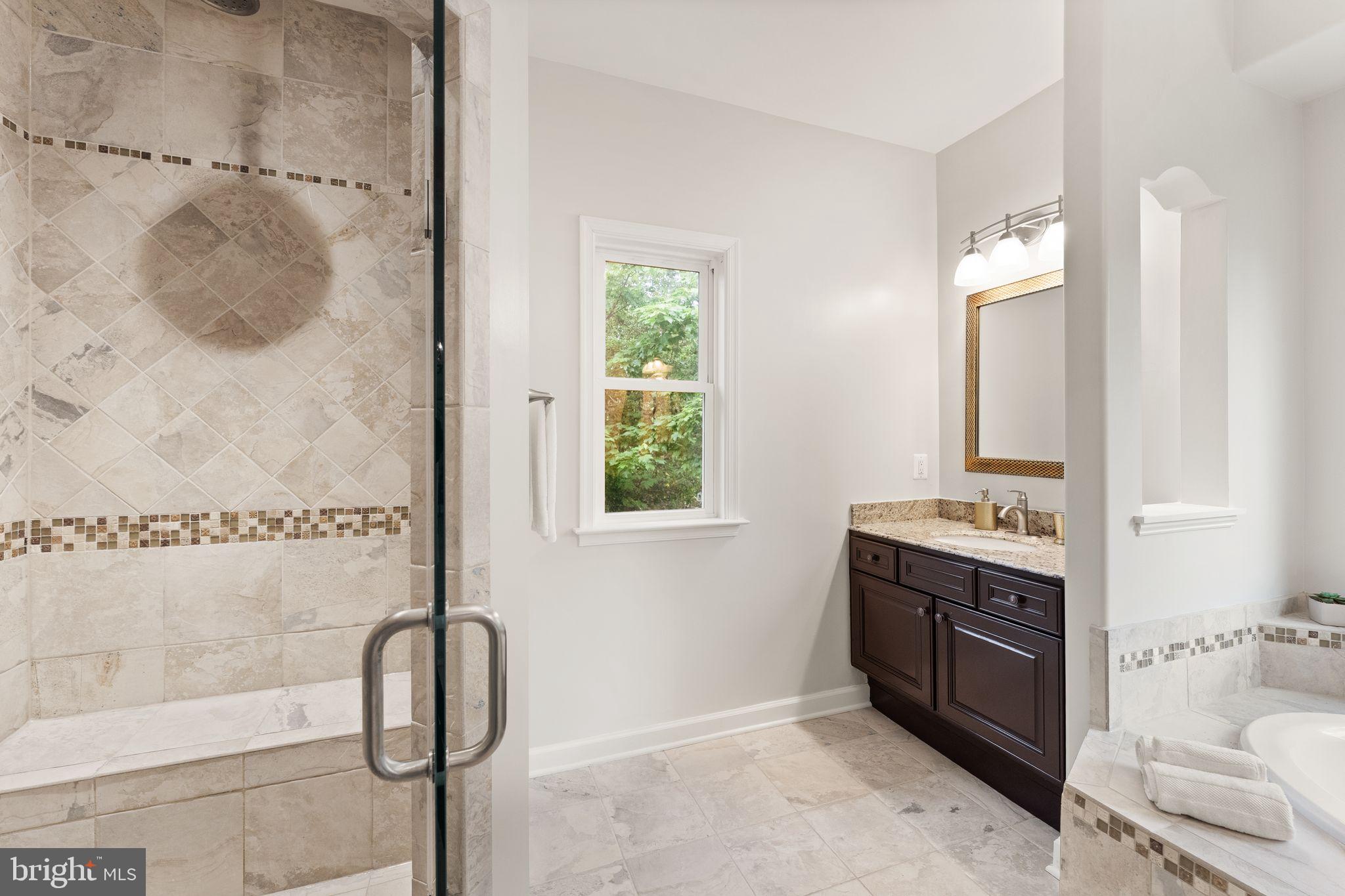 3906 Estel Road Fairfax, VA 22031 - Photo 61 of 122 a bathroom with a tub sink and mirror