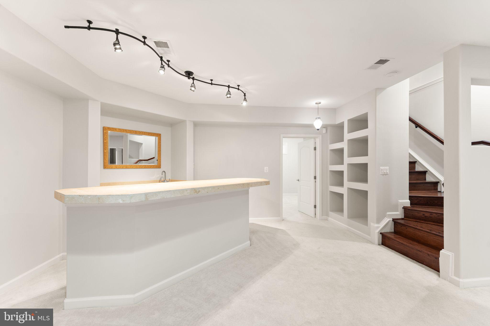 3906 Estel Road Fairfax, VA 22031 - Photo 88 of 122 a view of an empty room with stairs and a window