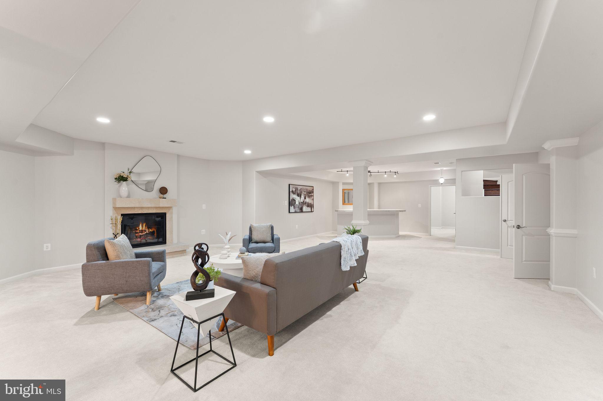 3906 Estel Road Fairfax, VA 22031 - Photo 93 of 122 a living room with furniture and a fireplace