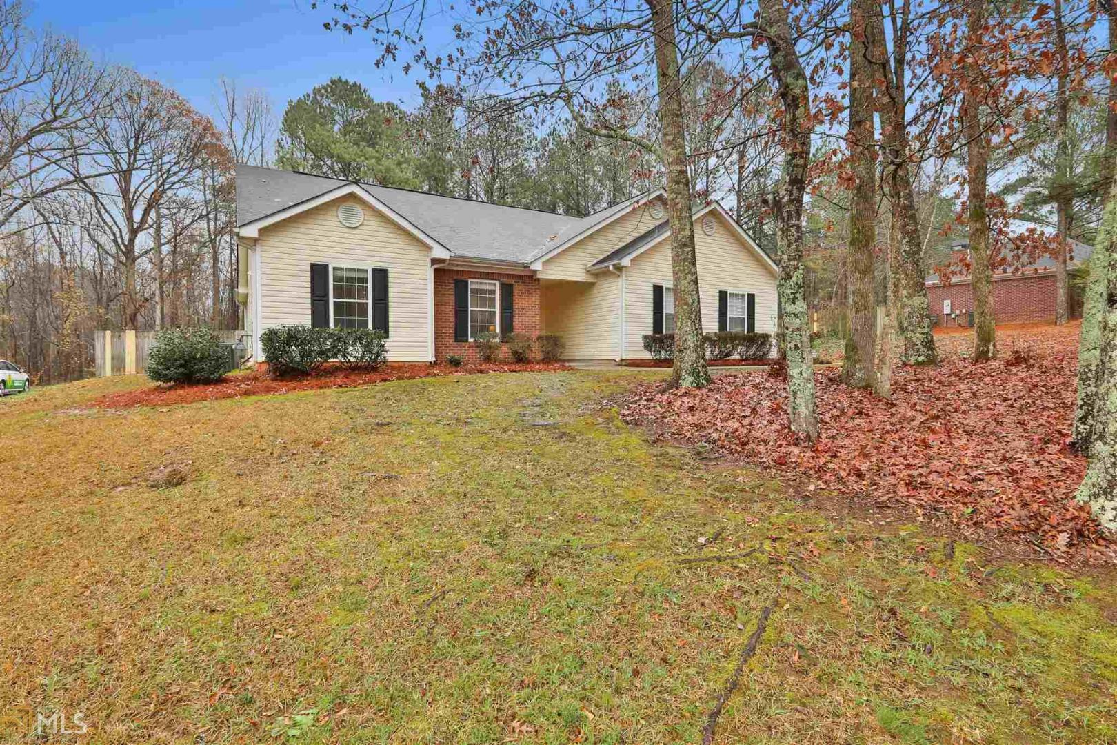 55 Riverside Way Sharpsburg, GA 30277 - Photo 1 of 1 a front view of a house with a yard and garage