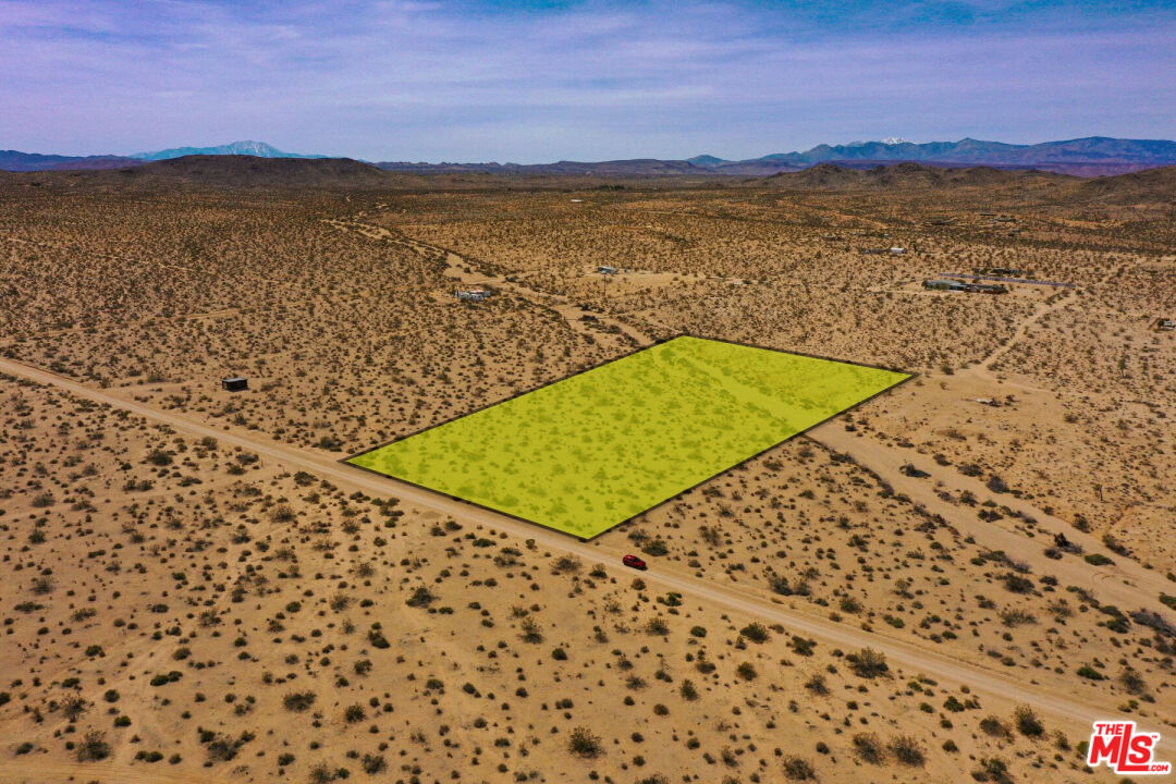 0 Vía Maria Joshua Tree, CA 92252 - Photo 13 of 13 a view of a lake with a building in the background