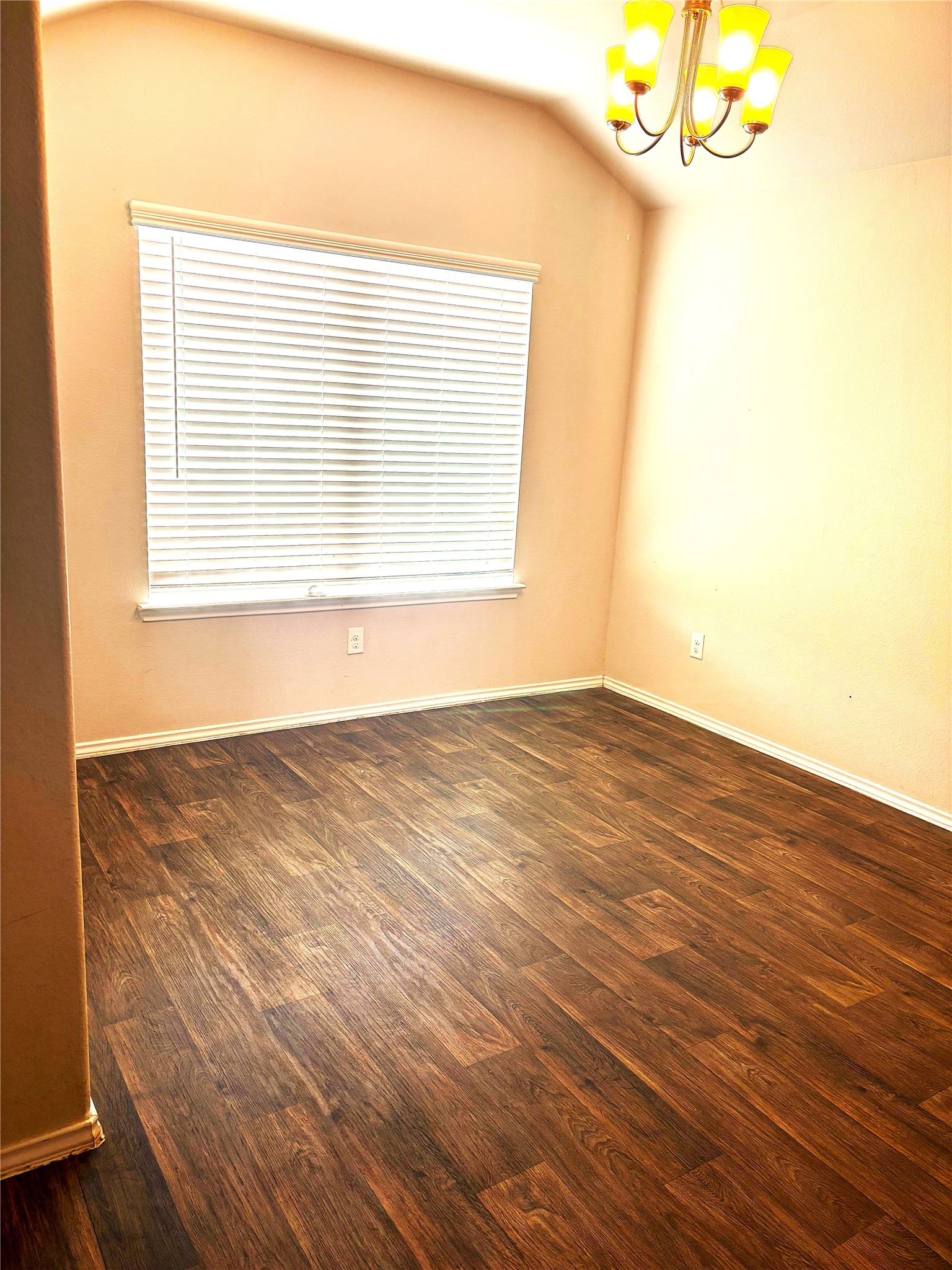 1210 Roca Rigida Trail Channelview, TX 77530 - Photo 9 of 14 a view of an empty room with wooden floor and a window