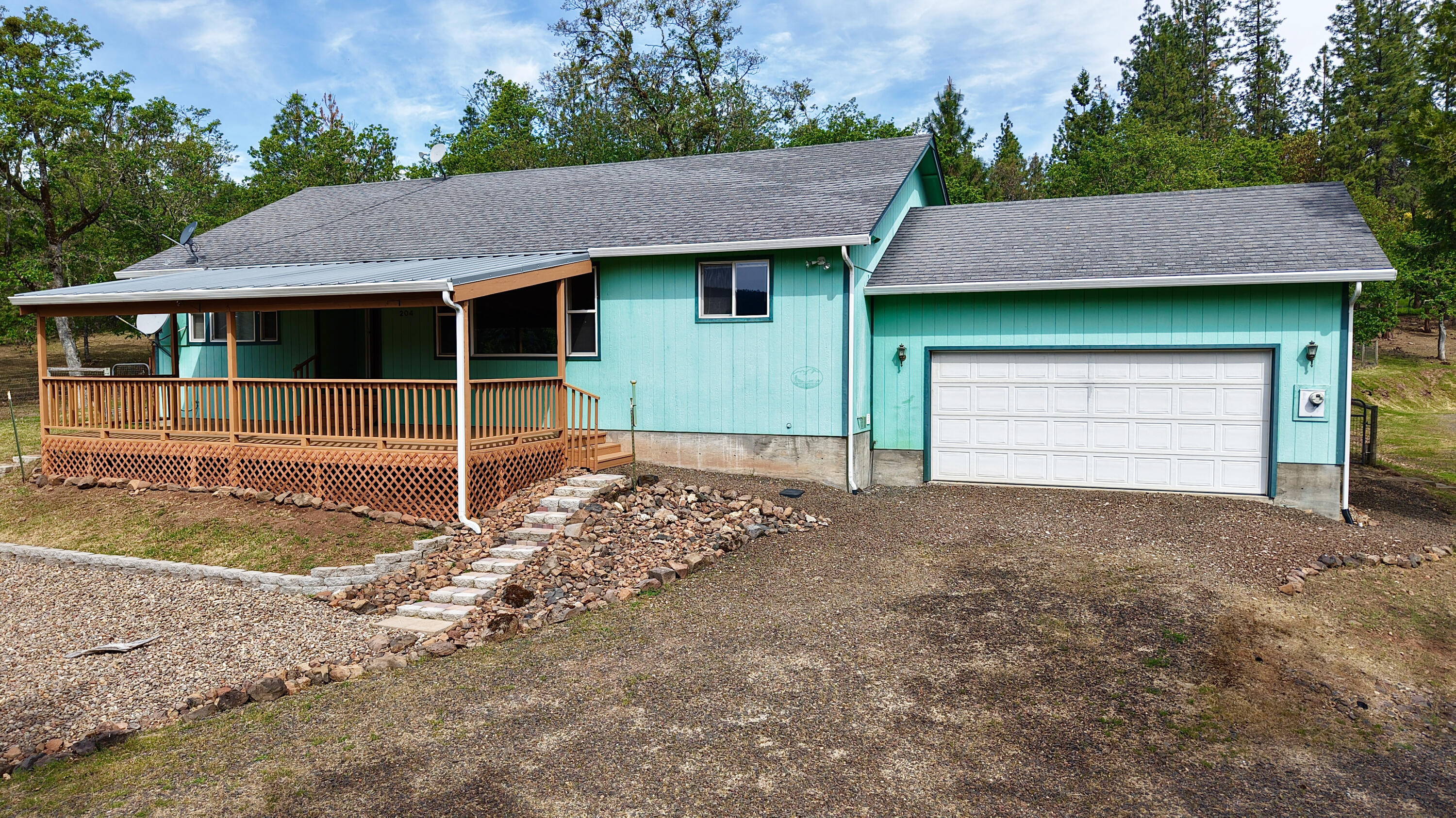 204 Shipley Terrace Prospect, OR 97536 - Photo 42 of 61 a front view of a house with garden