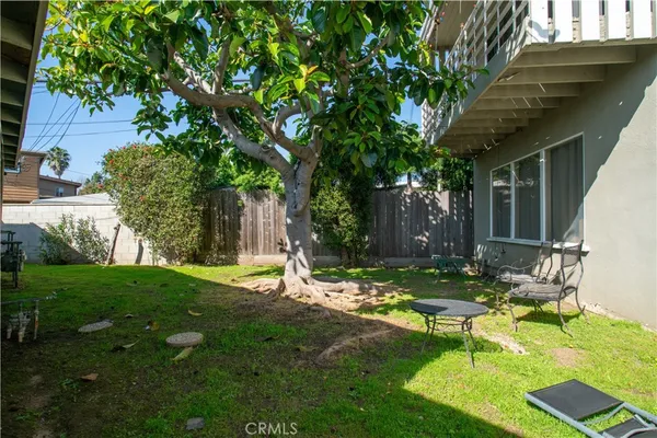 a view of a house with backyard porch and sitting area