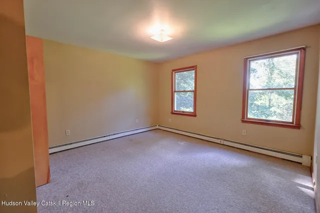 a bedroom with a bed and a closet