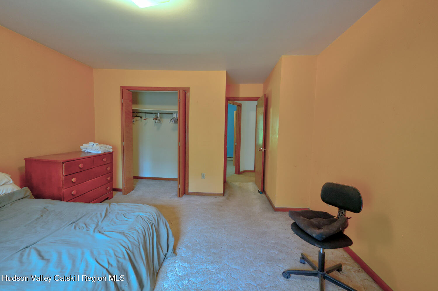 70 Horseneck Road Freehold, NY 12431 - Photo 42 of 70 a bedroom with a bed and a chair