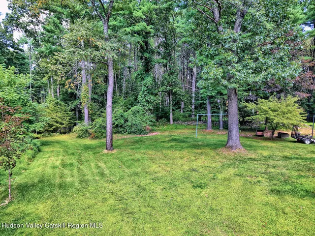 a backyard of a house with lots of green space