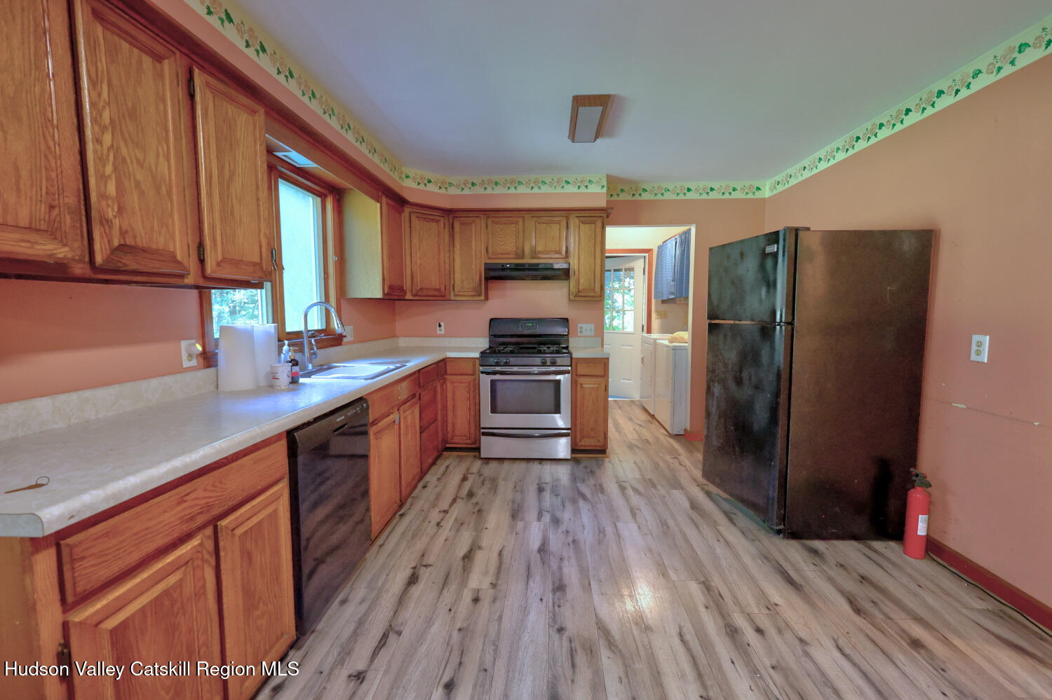 70 Horseneck Road Freehold, NY 12431 - Photo 9 of 70 a kitchen with stainless steel appliances a refrigerator and wooden floor