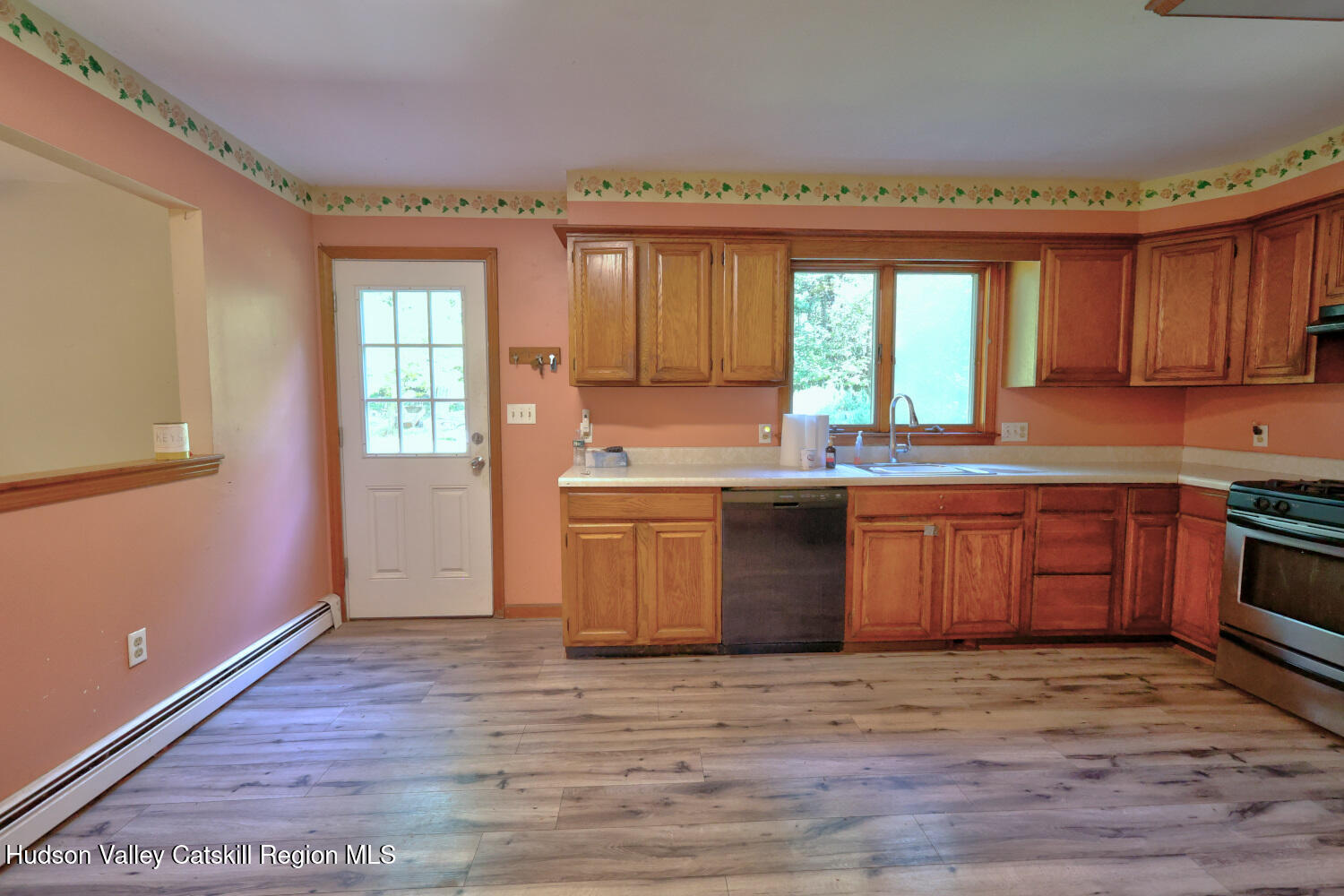 70 Horseneck Road Freehold, NY 12431 - Photo 10 of 70 a kitchen with granite countertop a stove a sink dishwasher and a microwave oven with wooden floor