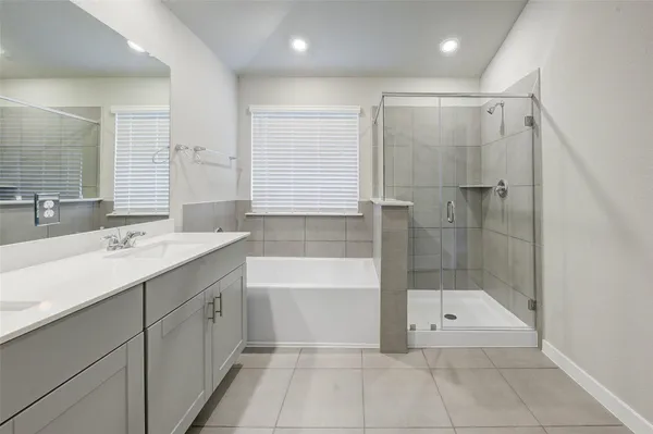 a bathroom with a bathtub and a sink