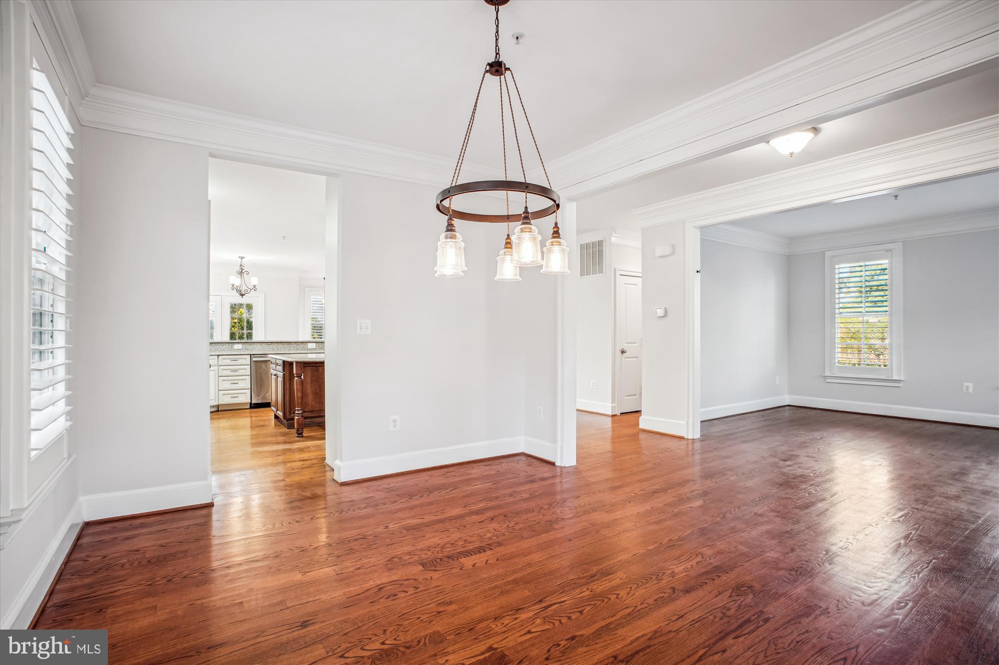 5512 Greentree Road Bethesda, MD 20817 - Photo 10 of 75 a view of a room with wooden floor window and a ceiling fan