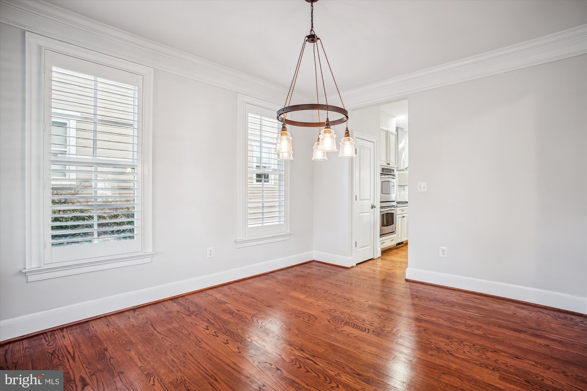 5512 Greentree Road Bethesda, MD 20817 - Photo 11 of 75 a view of empty room with wooden floor and window
