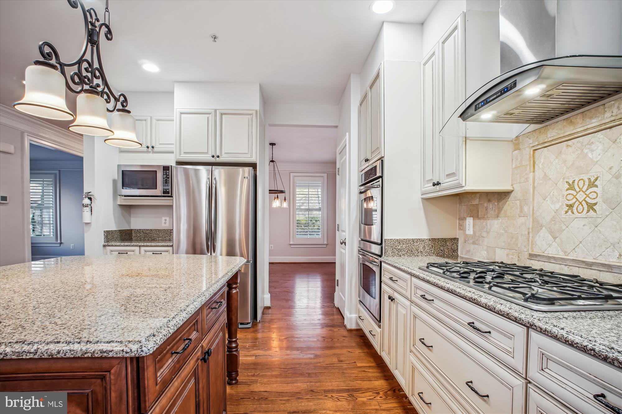 5512 Greentree Road Bethesda, MD 20817 - Photo 16 of 75 a kitchen with stainless steel appliances granite countertop a stove oven and a refrigerator