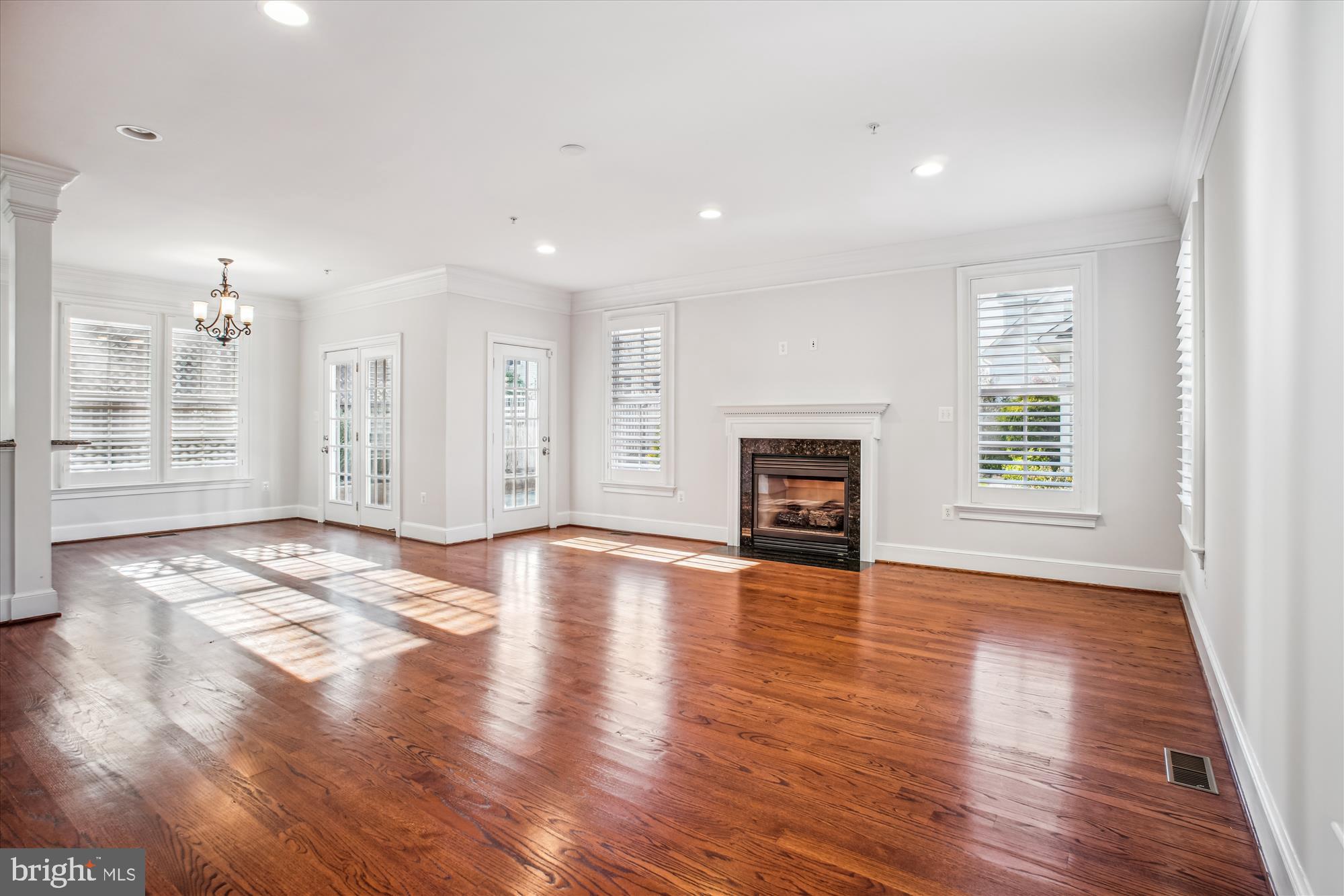5512 Greentree Road Bethesda, MD 20817 - Photo 23 of 75 a view of an empty room with wooden floor and a window