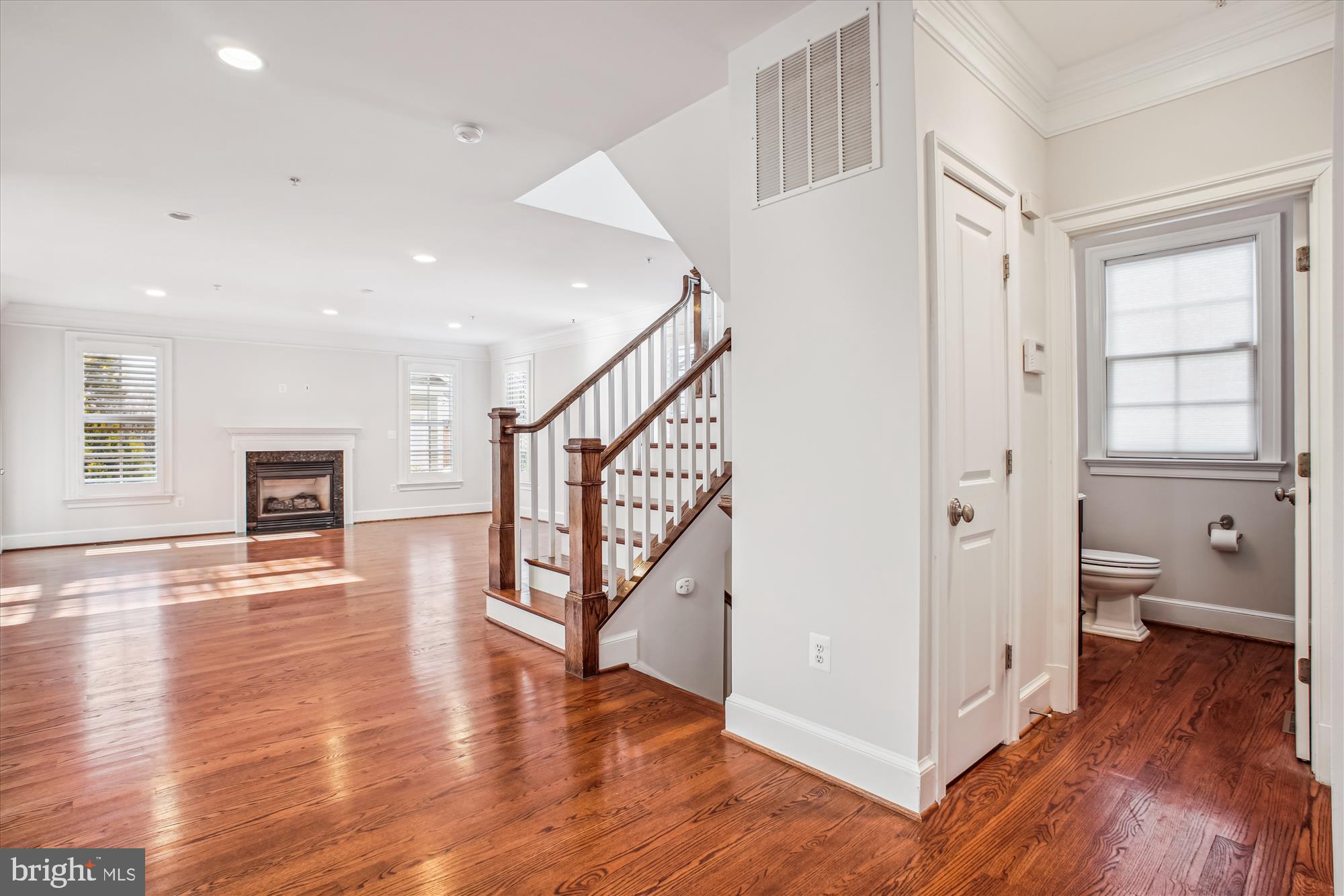 5512 Greentree Road Bethesda, MD 20817 - Photo 27 of 75 a view of an entryway with wooden floor and a living room