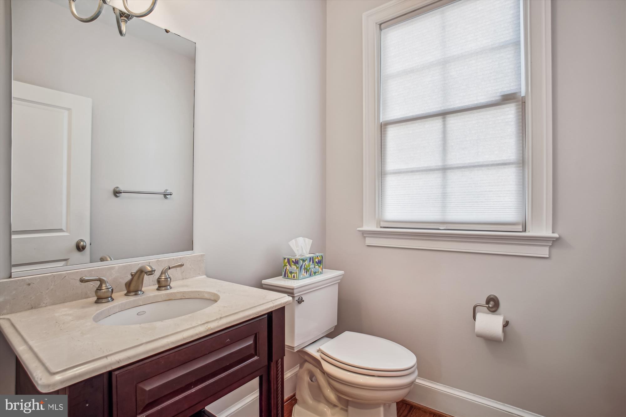 5512 Greentree Road Bethesda, MD 20817 - Photo 28 of 75 a bathroom with a sink a toilet and a mirror