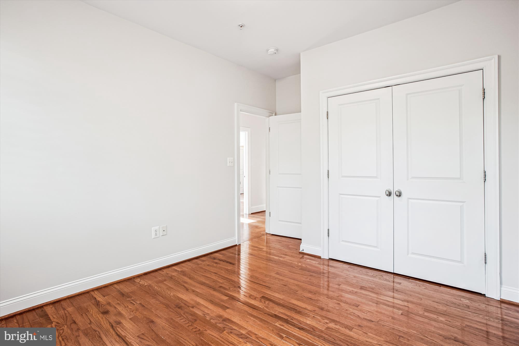 5512 Greentree Road Bethesda, MD 20817 - Photo 46 of 75 an empty room with wooden floor