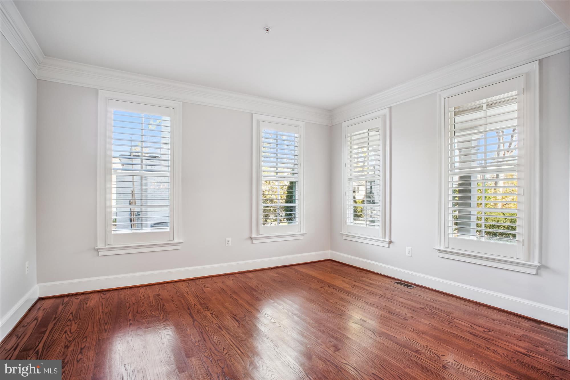 5512 Greentree Road Bethesda, MD 20817 - Photo 7 of 75 an empty room with wooden floor and windows