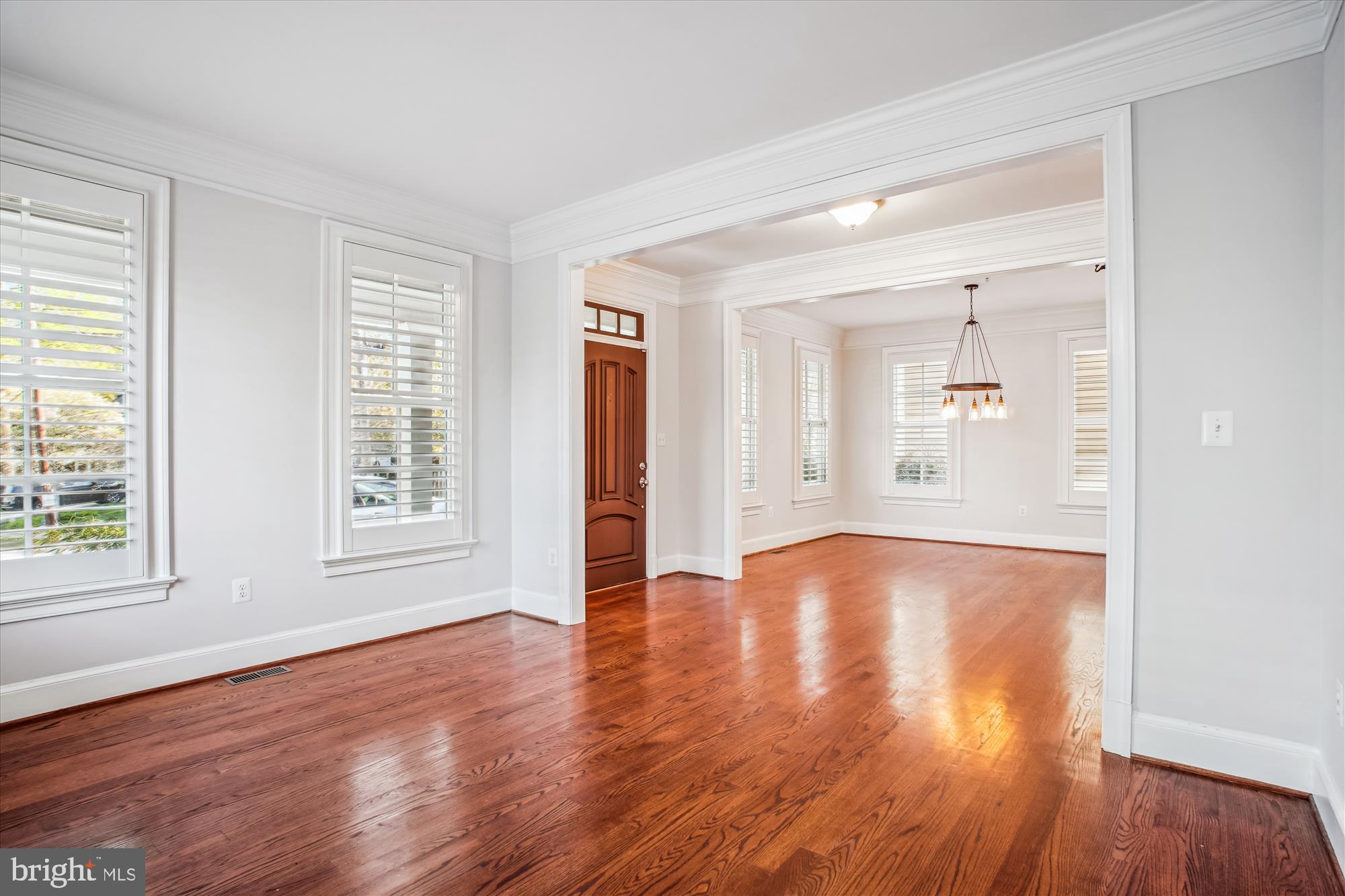 5512 Greentree Road Bethesda, MD 20817 - Photo 8 of 75 an empty room with wooden floor and windows