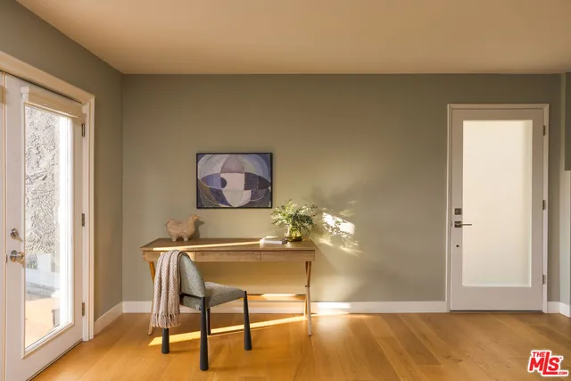 a workspace with furniture and window