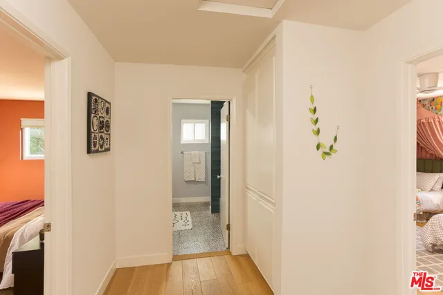 a bedroom with bed and a window