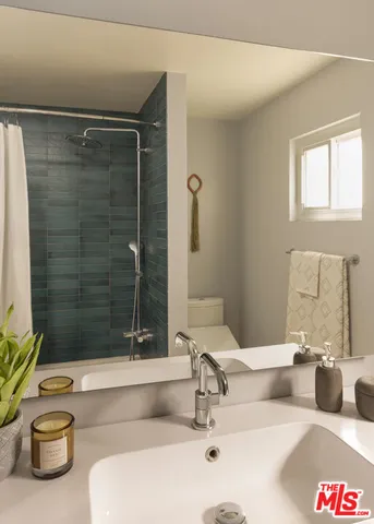 a bedroom with two beds and a walk in closet