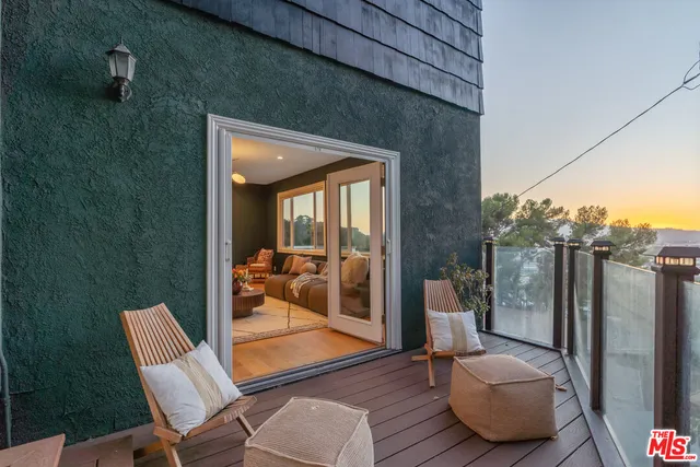 a view of a yard with wooden fence