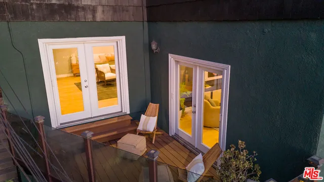 a outdoor living space with patio furniture and potted plants