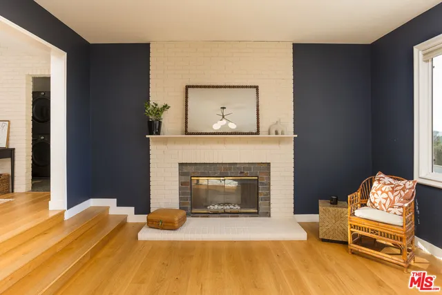 a bedroom with a fireplace and a bed